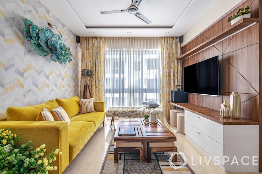  interior design for 2bhk flat-yellow sofa-sheer curtains