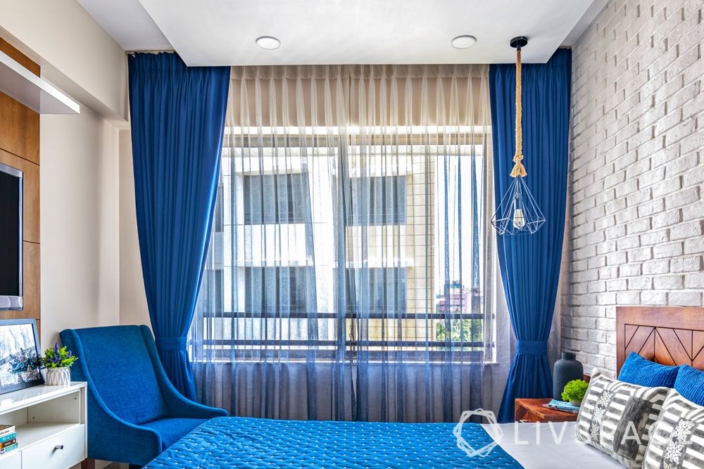 blue accent chair-blue curtains-sheer curtains
