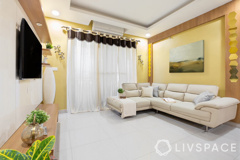 best interiors in hyderabad-white sofa-yellow walls
