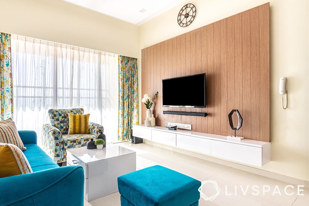 blue sofa-pattern armchair-custom tv unit-dining room-blue living room