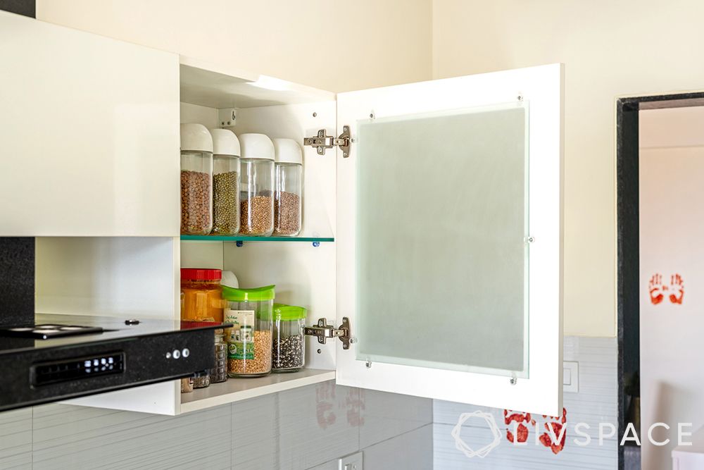 Lime green cabinets-white wall cabinets-tandem drawers-granite countertop-marine ply laminate finish-glass shutters-tandem-granite-semi modular