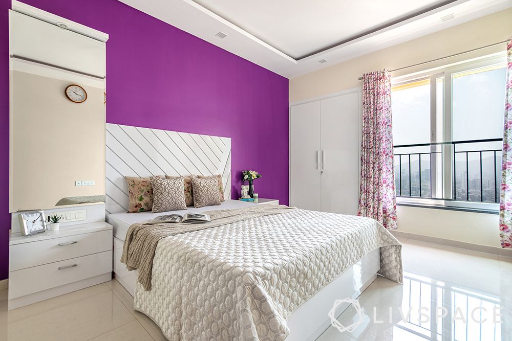 interior designer in thane-master bedroom-purple walls-custom bed-vanity unit-glossy wardrobes 