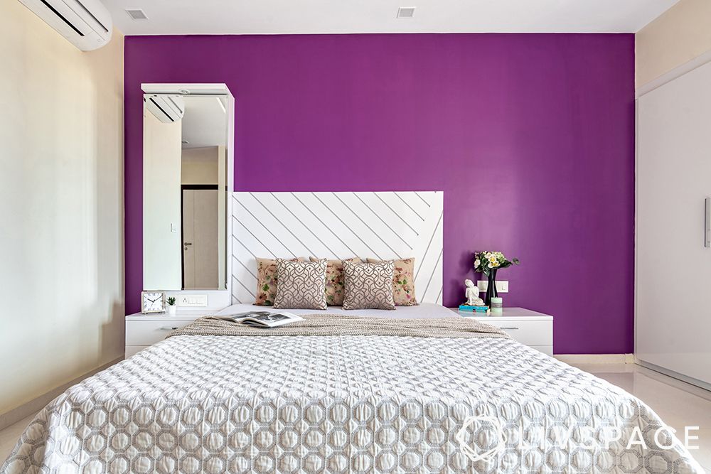 interior designer in thane-master bedroom-purple walls-custom bed-vanity unit-glossy wardrobes