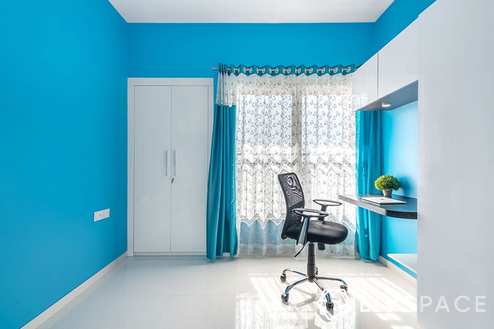 interior designer in thane-blue paint walls-blue and white themed room-study unit-wardrobe