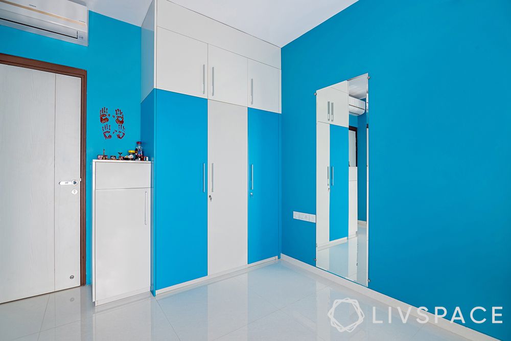 interior designer in thane-blue paint walls-blue and white themed room-study unit-wardrobe