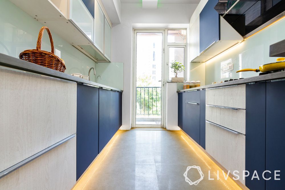 vitrified tiles vs marble-tile flooring-blue and white kitchen