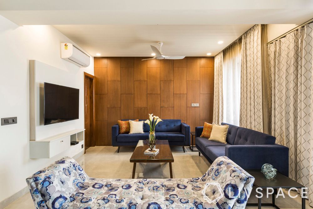 beautiful-houses-photos-living-room-blue-sofas-TV-wood-wall
