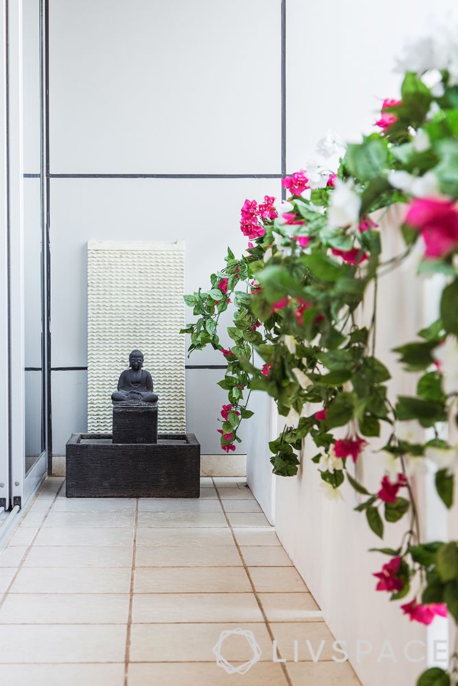 small-balcony-ideas-zen-buddha-white-wall-flowers