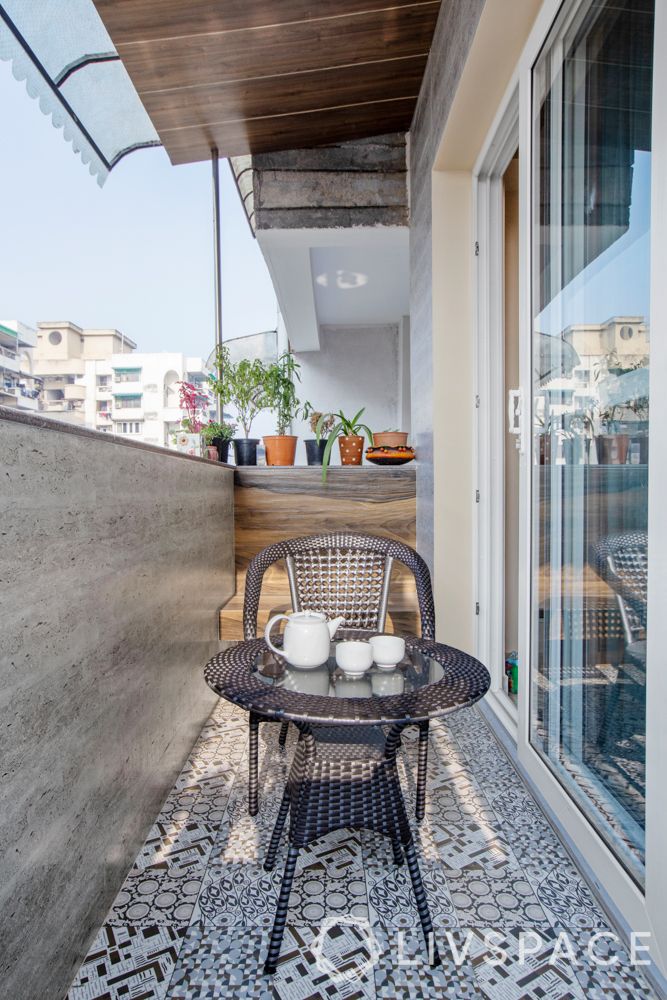 small balcony-patterned tiles-wicker furniture