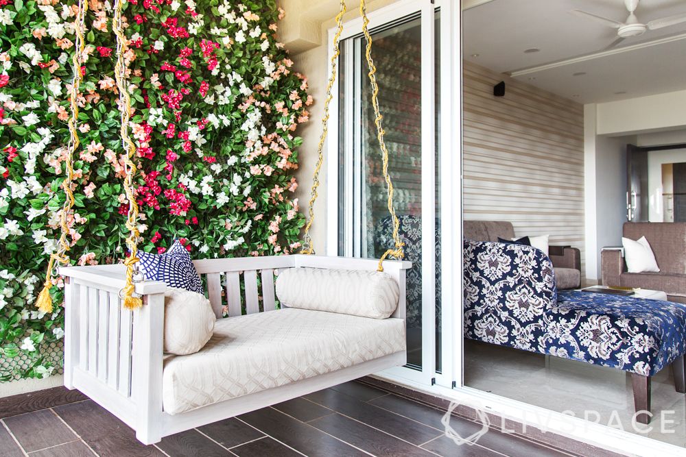 balcony design ideas-floral wall-cushioned swing