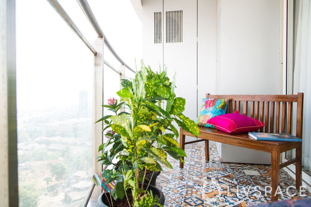 balcony design ideas-bright cushions-potted plant