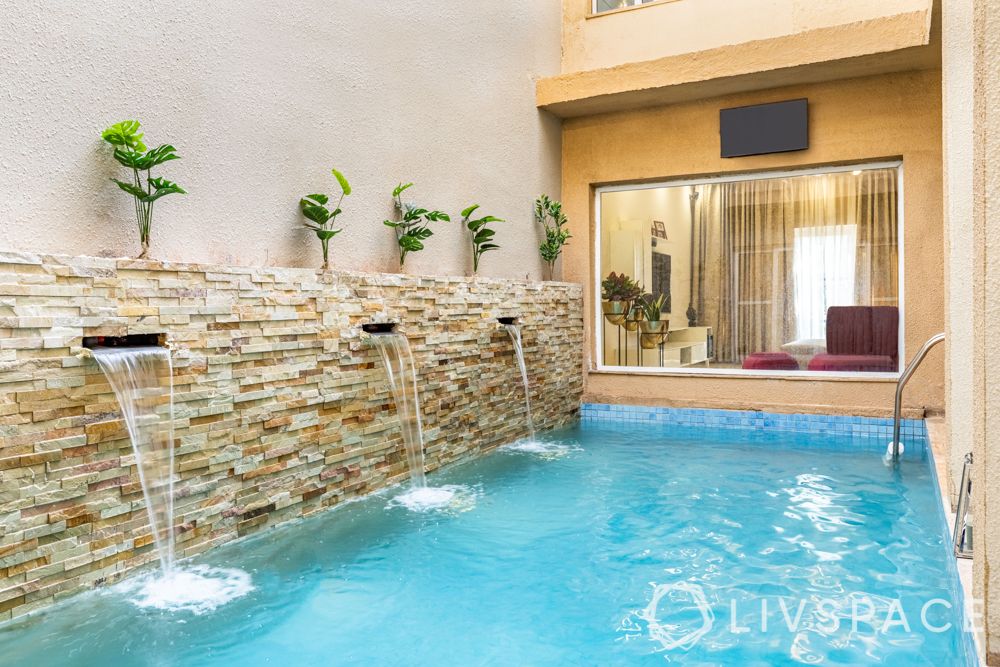 villa interior designer-pool-stone cladded wall