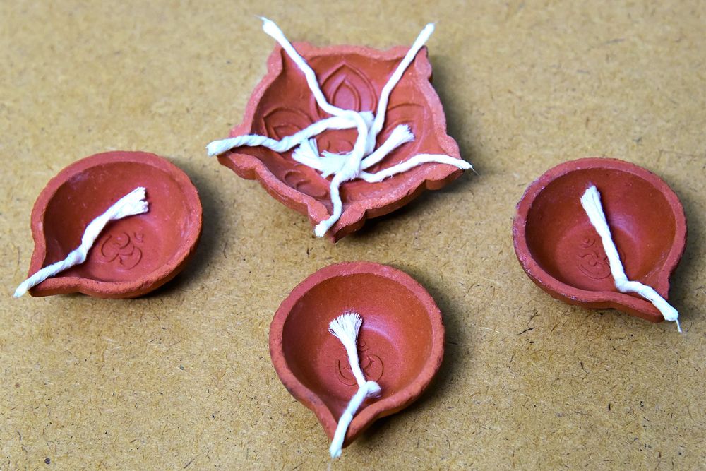 making-diyas-at-home-knead-clay-into -diya