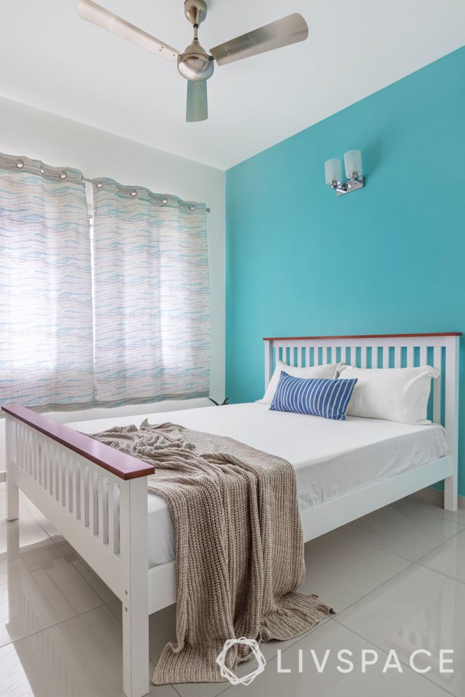 white bed-sky blue wall
