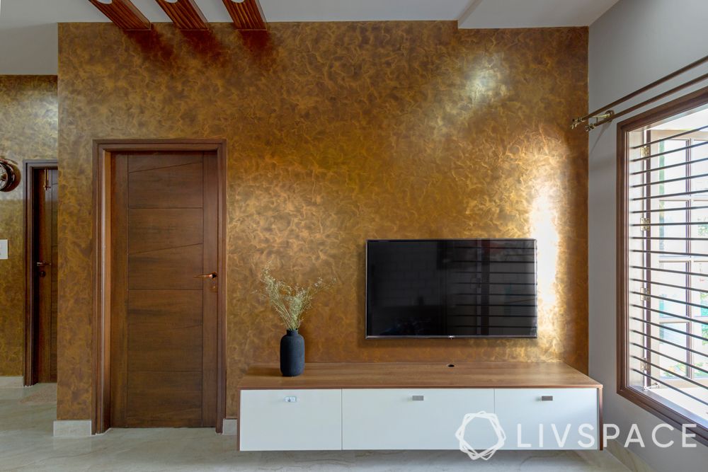 TV unit cabinet-gold accent wall