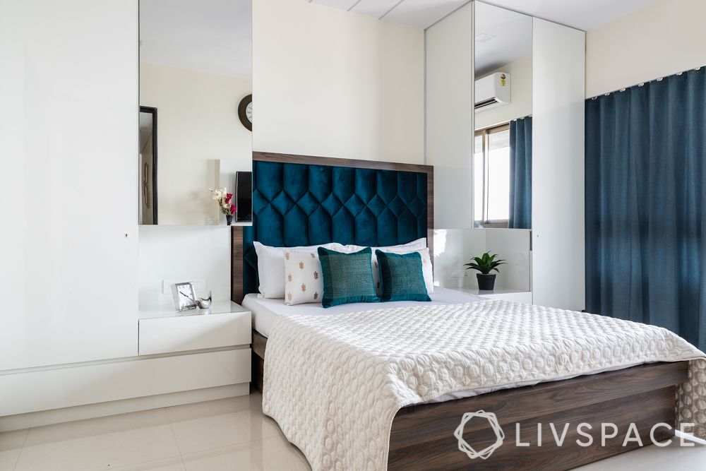 bedroom design-blue headboard-mirror shutter wardrobes