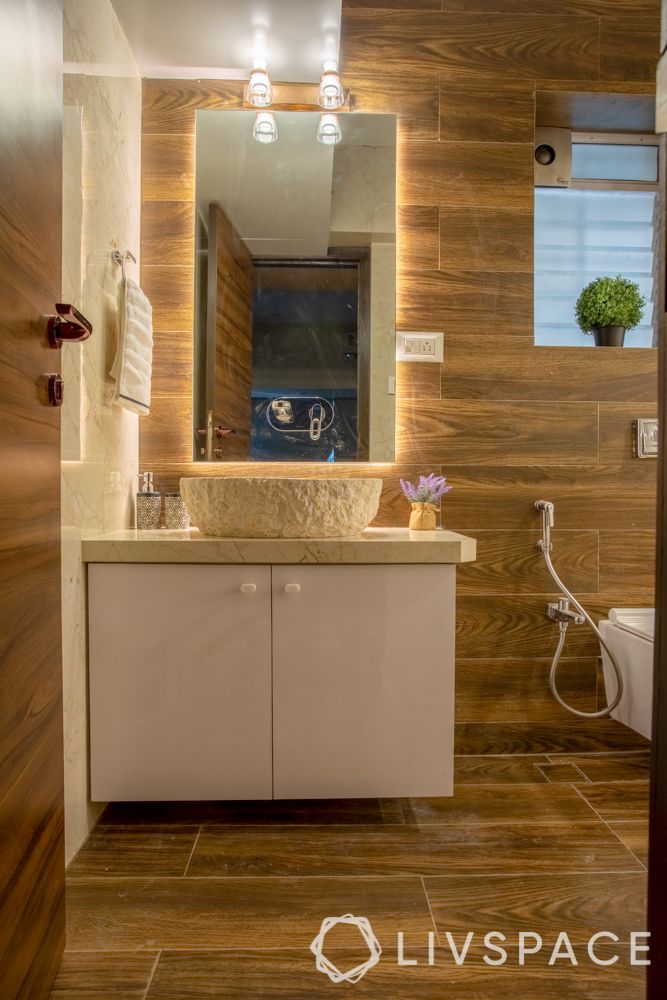 2bhk mumbai interiors-bathroom-mirror lighting-cecilia marble basin-laminate storage