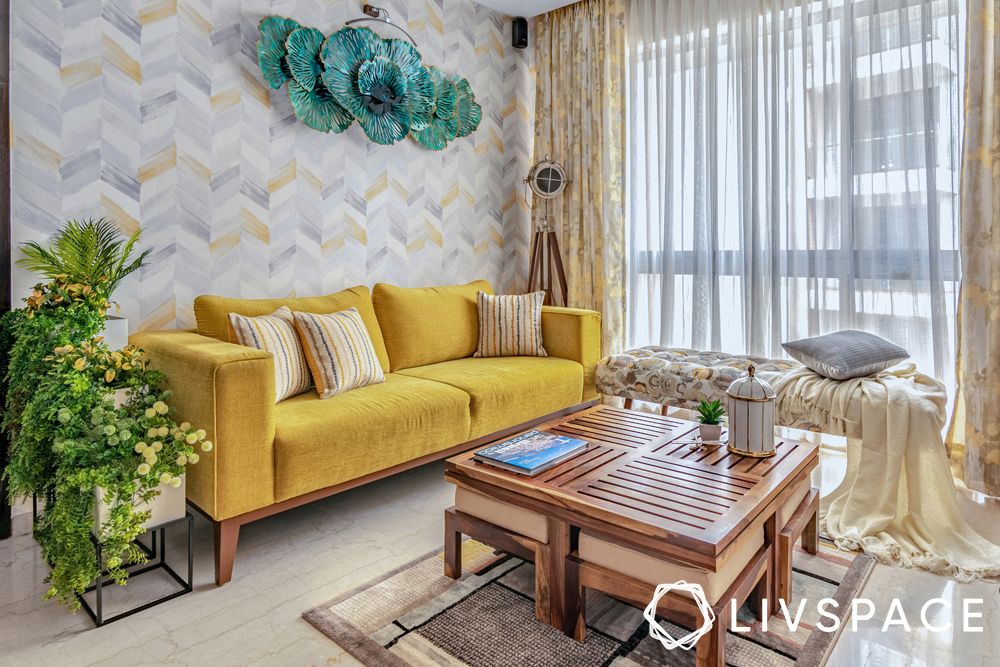 2BHK house design-living room-yellow sofa-wooden table-accent wall