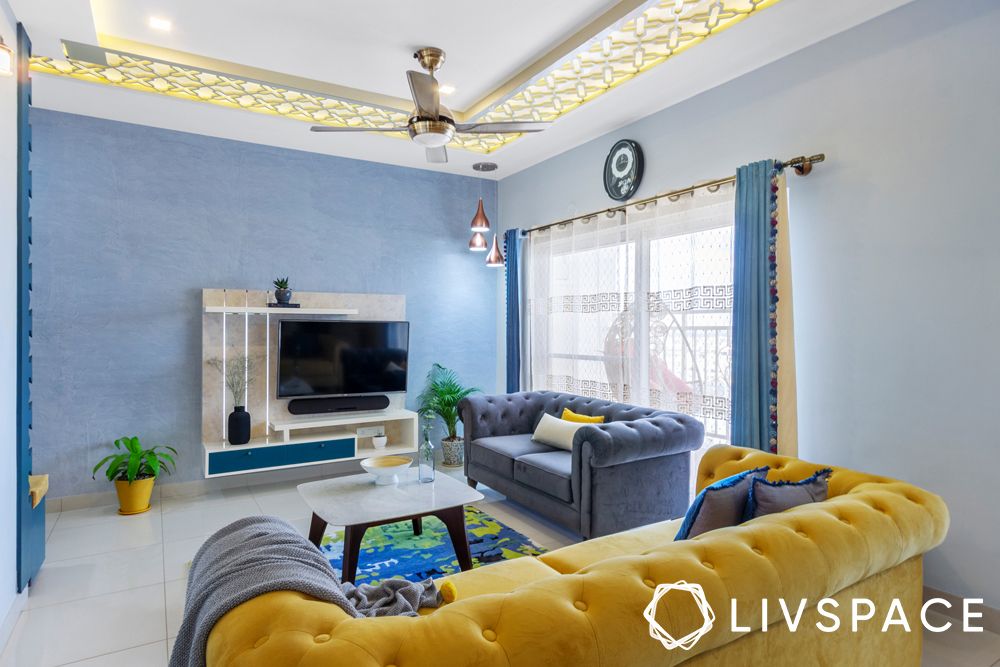 2BHK house design-living room-tufted sofa-TV unit-false ceiling