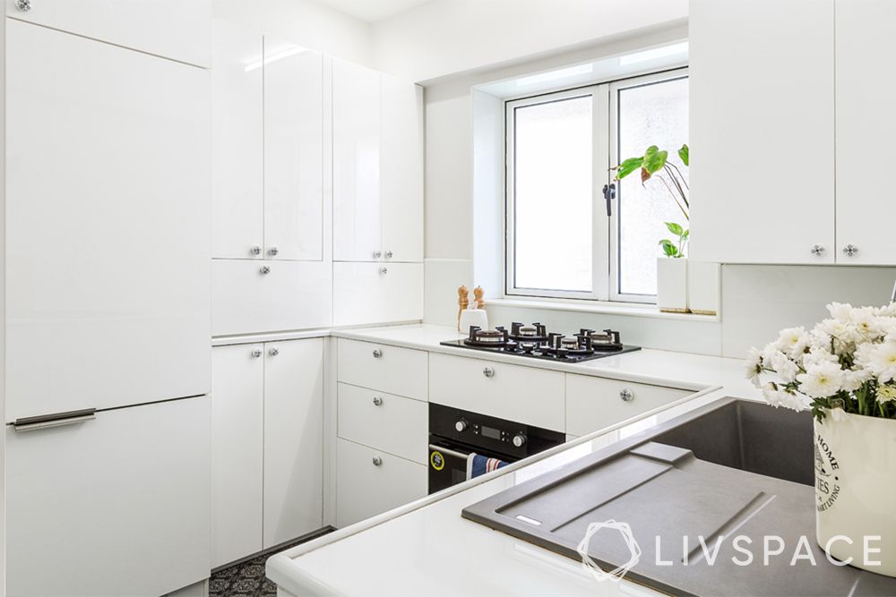 small kitchen design-white-upper-lower-cabinets-counter-sink-hob-window