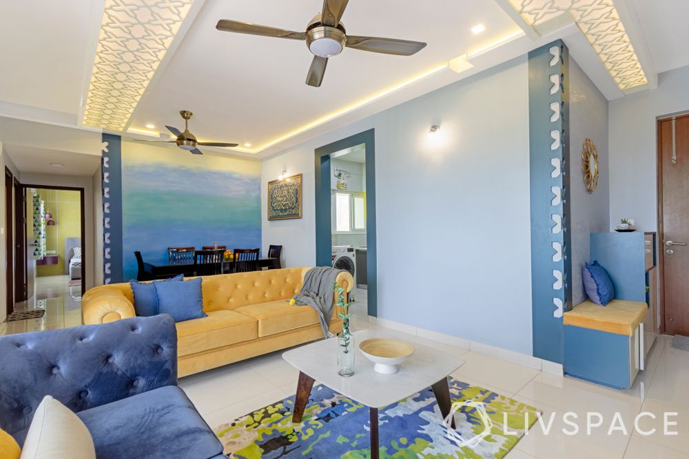 living room-jaali panel on wall-blue walls
