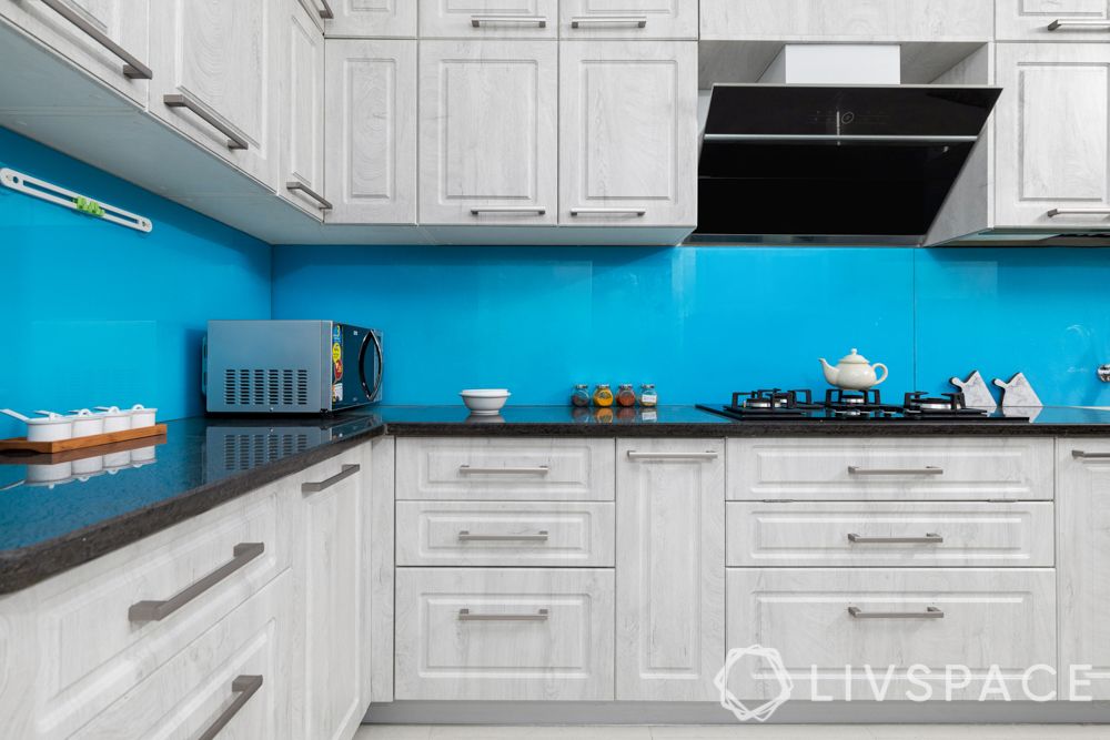 kitchen design-blue backsplash-distressed cabinet finish