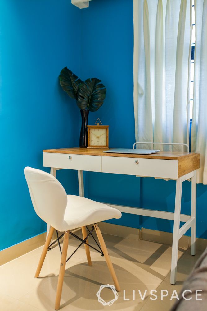console desk design-blue wall-white chair