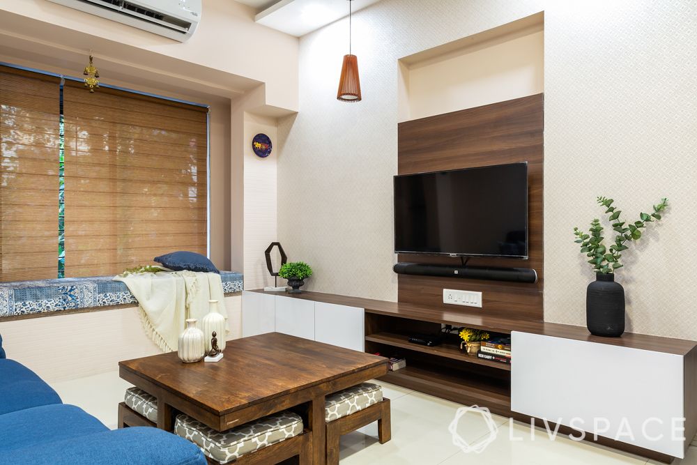 top-interior-designers-in-Mumbai-simple-living-room-wooden-units-TV-unit-window-seating