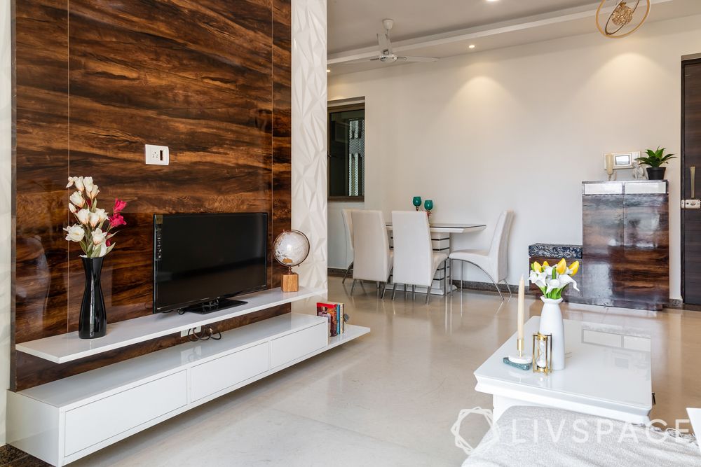 mumbai house-living room-glossy TV unit-wooden panelling