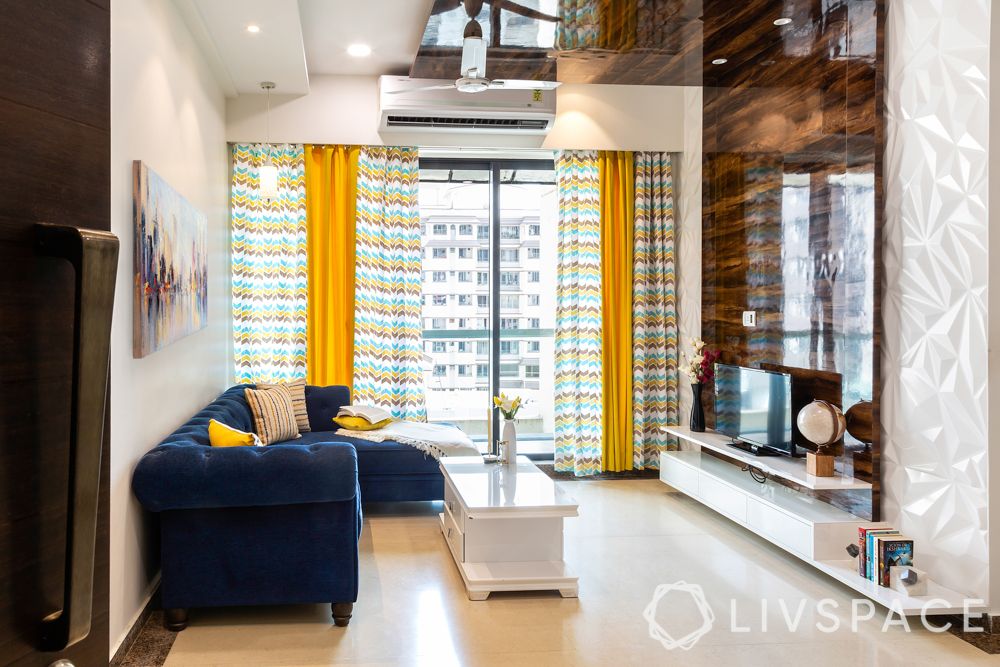 mumbai house-living room-neutral colours-white centre table-blue sofa