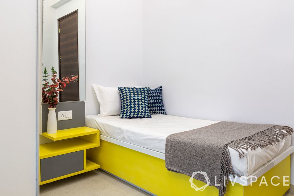 mumbai house-bedroom-hydraulic bed-yellow furniture-dresser and storage unit