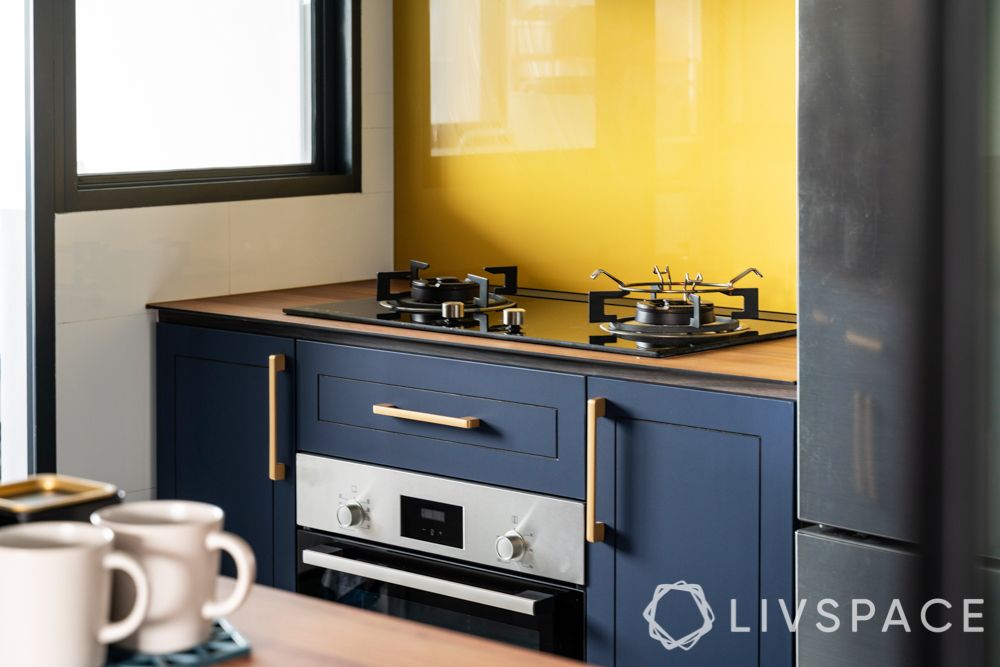 clean kitchen-blue kitchen-glass backsplash 