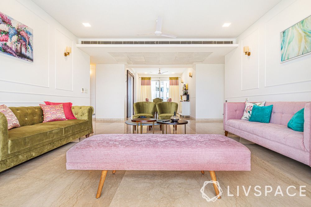 interior designers Delhi-pastel themed living room-dusty pink sofa-dusty pink Zuri bench-olive green sofa-wall trims