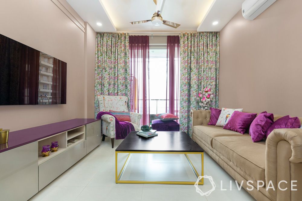 living-room-ideas-vertical-space-curtains-pink-wall-beige-couch-white-purple-TV-unit