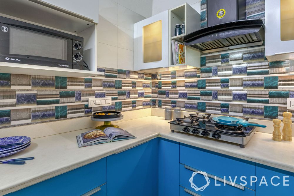 small-kitchen-interior-blue-white-storage-cream-counter-hob-chimney