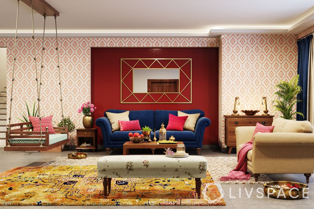 maximalism-red-white-wall-blue-couch-jhoola-yellow-rug