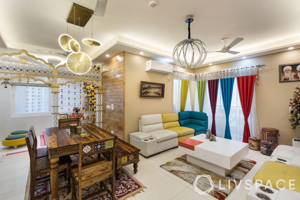 maximalism-living-room-3-bhk-dining-area-white-yellow-blue-sofa-colourful-curtains-pendant-lights
