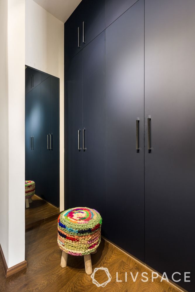 wardrobe-design-navy-wardrobe-doors-multi-coloured-cotton-pouffe