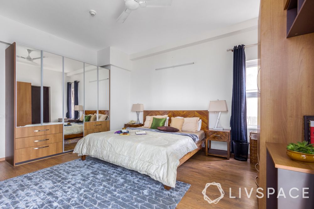 simple-bedroom-design-wooden-finish-and-blue-rug