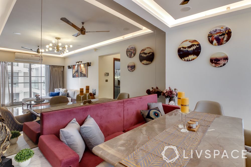 hometour-apartment-in-mumbai-dining-area-mirror-wall-pink-sofa-marble-top-dining-tabel