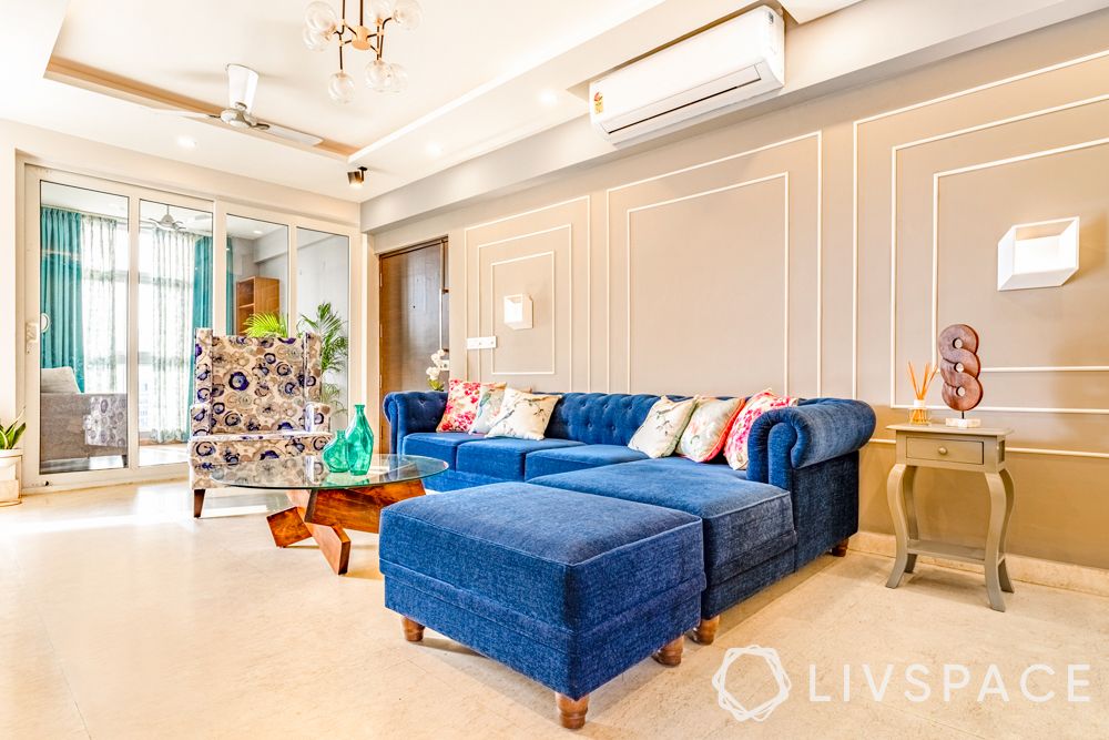 4-bhk-flats-in-gurgaon-living-room-blue-L-shaped-sofa