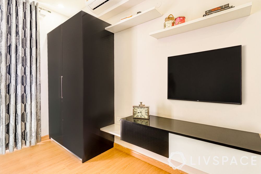 spacious-flats-in-gurgaon-acrylic-black-wardrobe-TV-unit