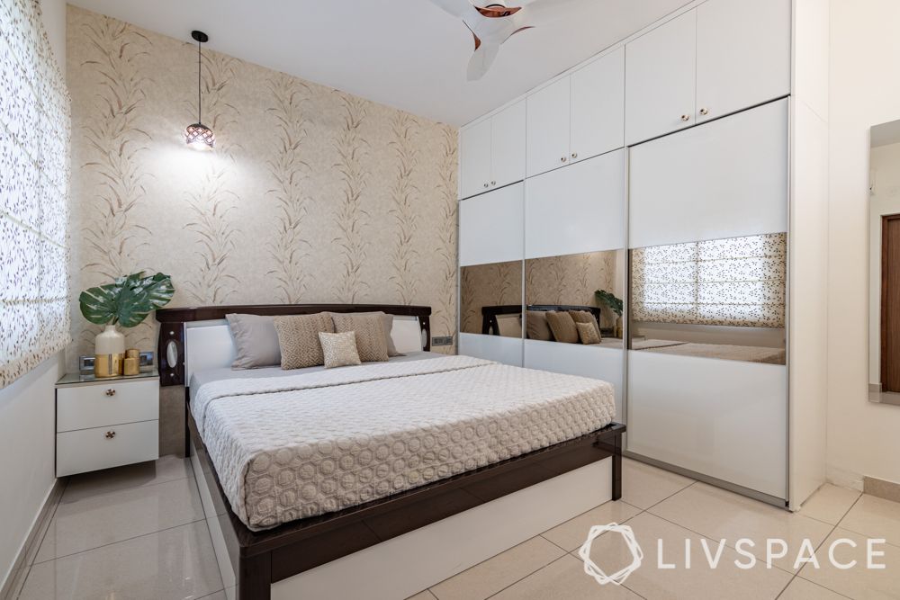 2-bhk-flat-in-bangalore-master-bedroom-three-door-sliding-laminate-wardrobe
