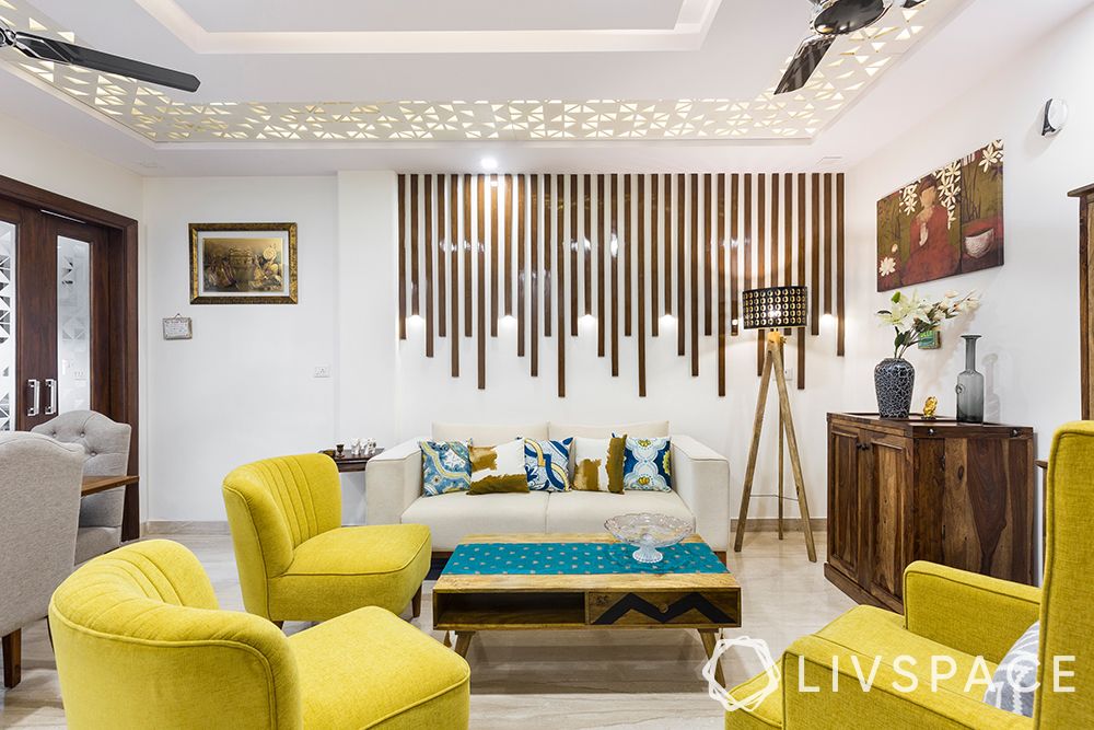 delhi-house-design-living-room-false-ceiling-wooden-pattis-yellow-sofa