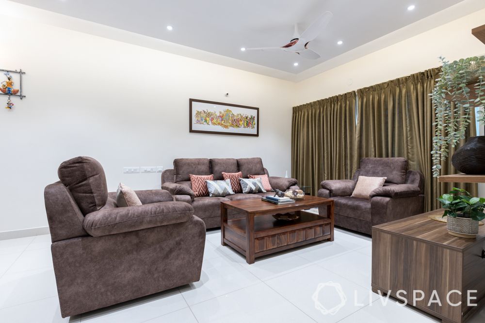 3bhk-flat-in-bangalore-living-room-island-ceiling-olive-curtains-brown-sofa