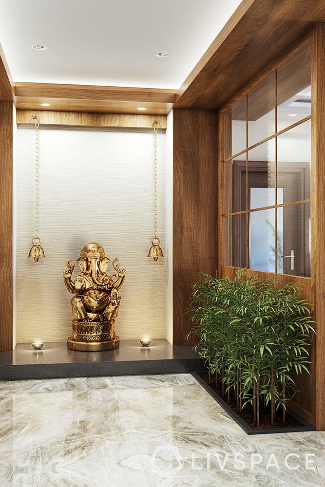 wood-and-glass-partition-wall-gold-bells-ganesha-statue
