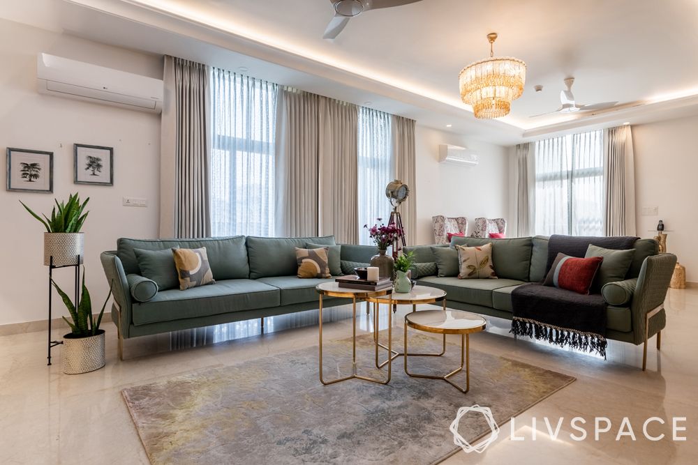penthouse-in-noida-living-room-green-sofa