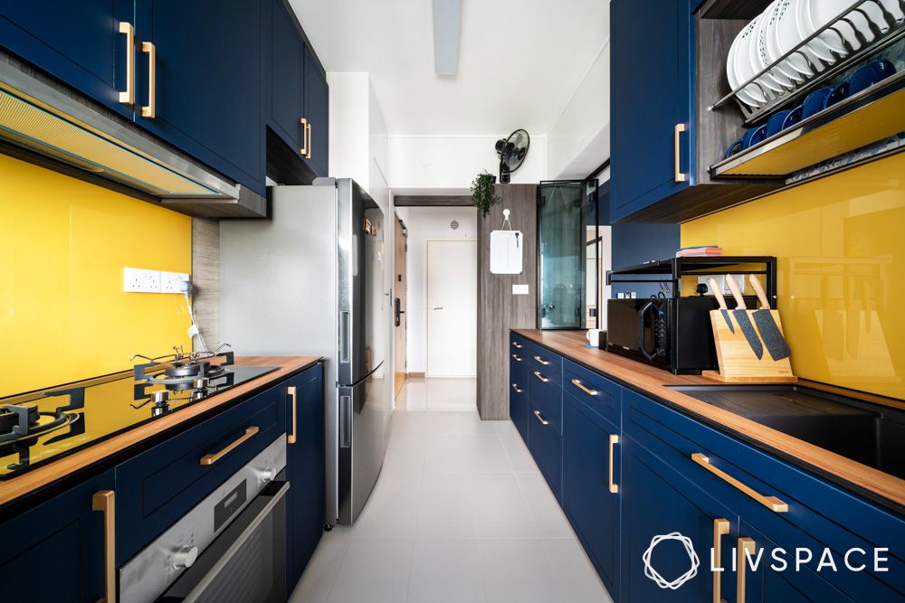 dark-blue-cabinets-with-brass-handle