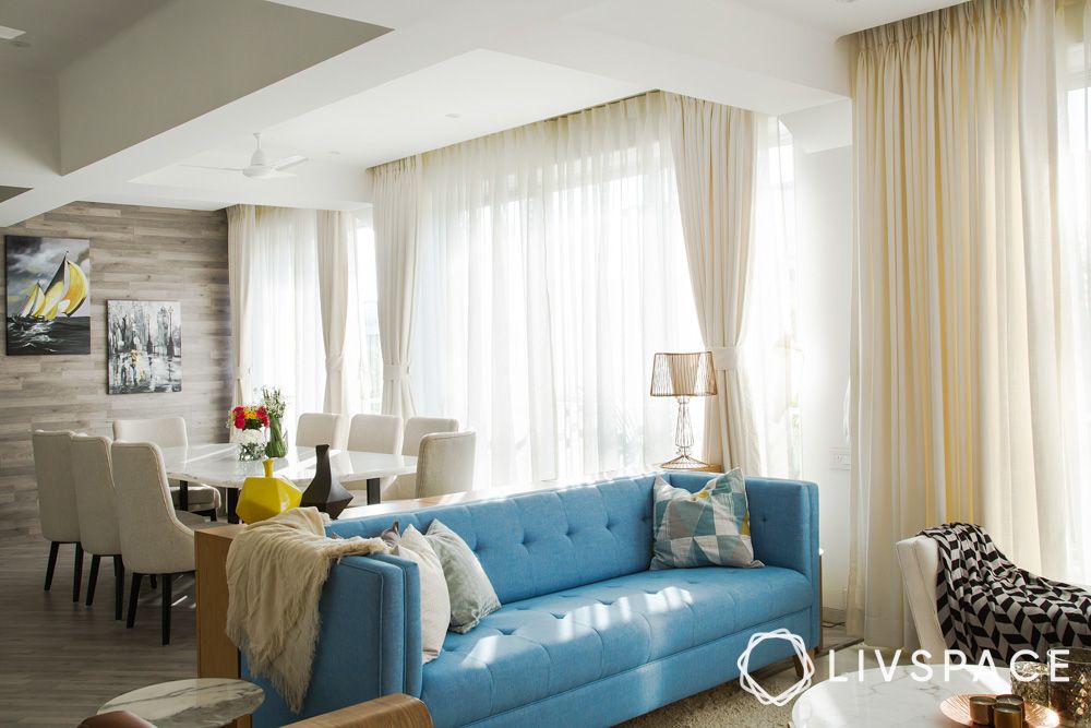 white-living-room-with-blue-sofa