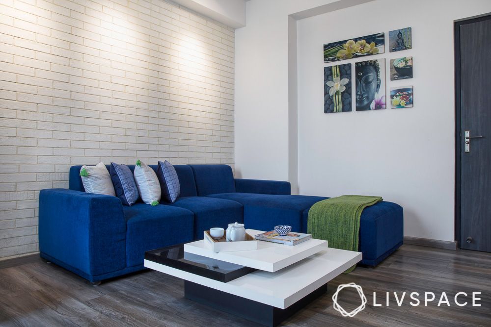 New-house-design-entertainment-room-blue-sofa-white-exposed-brick-accent-wall